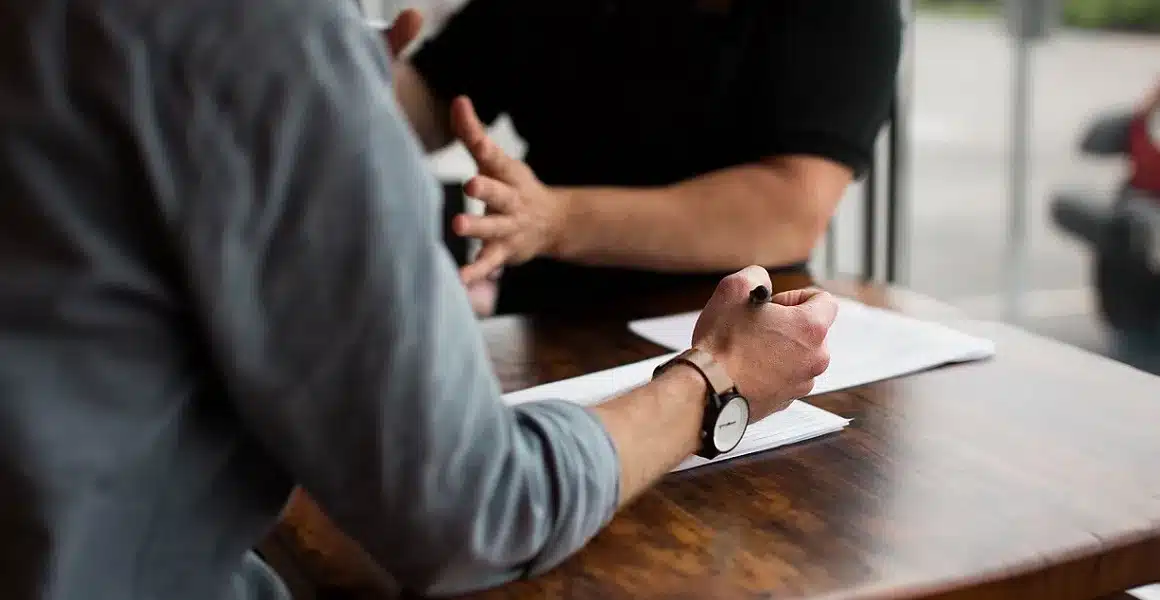 hands at desk reviewing document