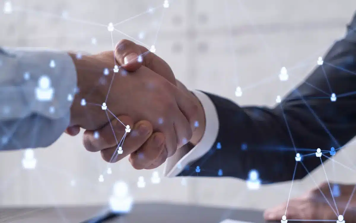 close up 2 hands shaking eachother